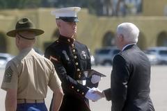 Secretary of Defense Robert M. Gates awarding a Marine honor graduate at the Marine Corps Recruit Depot graduation in San Diego