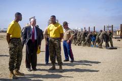 Secretary of Defense Robert M. Gates observing Marine recruits during training at Combat Conditioning Field Marine Corps Recruit Depot San Diego