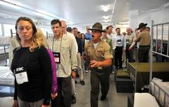 Participants of the DoD Joint Civilian Orientation Conference receiving attention from a drill instructor at Marine Corps Recruit Depot San Diego