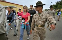 Participants marching under watchful Drill Instructor Sgt. Gustava Brown at Marine Corps Recruit Depot San Diego