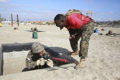 Marine drill instructor correcting recruit during Bayonet Assault Course at Marine Corps Recruit Depot San Diego