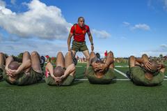 U.S. Marine Corps drill instructor motivating recruits during physical training at Marine Corps Recruit Depot San Diego on March 29, 2022