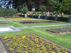 Terraced garden of Villa Taranto in Verbania with lush greenery and pathways