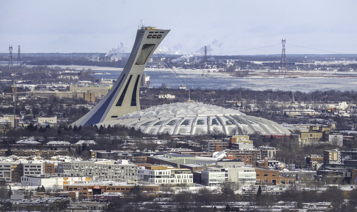 Aerial view of Olympic Stadium of Montreal with cityscape in the background