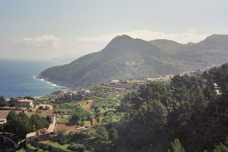 Panoramic view of Banyalbufar village surrounded by terraced hills and Mediterranean vegetation