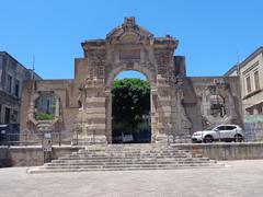Porta Grazia entrance gate in Messina, historic monument with stone arch and detailed architecture under a cloudy sky
