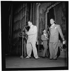 Black and white portrait of jazz musicians Arnett Cobb playing tenor saxophone and Walter Buchanan on double bass at Apollo Theatre, New York, 1947