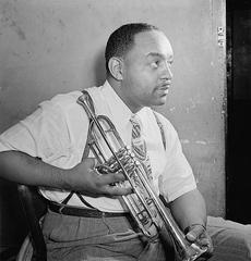 Benny Carter playing the saxophone at The Apollo Theater in 1946