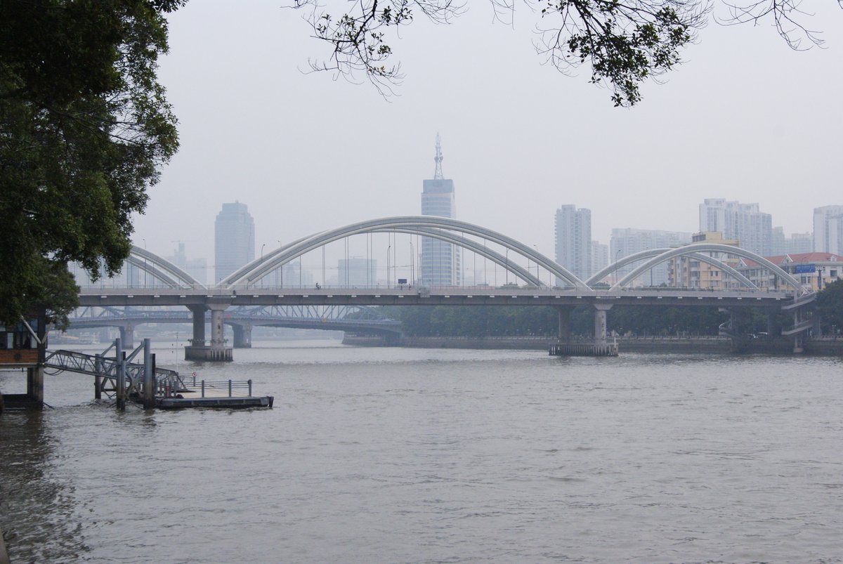 Jiefang Bridge in Guangzhou China spanning over the Pearl River at night with city lights