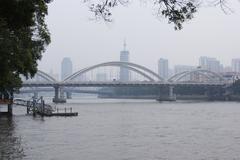 Jiefang Bridge in Guangzhou China spanning over the Pearl River at night with city lights