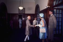 Prime Minister Jawaharlal Nehru greeting First Lady Jacqueline Kennedy at Teen Murti Bhavan in New Delhi