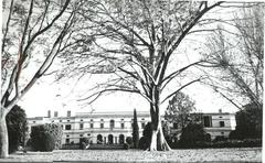 Front view of Teen Murti House with colonial architecture and lush greenery