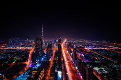 Skyline of Dubai featuring iconic skyscrapers and modern architecture under blue sky
