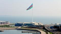 Baku Flagpole with Azerbaijani flag flying high in a clear blue sky