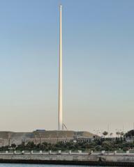 Tall flagpole with the national flag flying in Baku during daylight