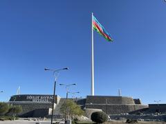 New Baku Flagpole towering against a clear blue sky