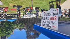 Protest banner reading 'From Palestine to the Philippines, Stop the US War Machine' at Warren Mall, UCSD