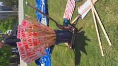 Pink signs saying UAW on Strike Unfair Labor Practices at Warren Mall UCSD