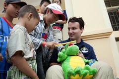 Ryan Fleming teaching Vietnamese children tooth brushing