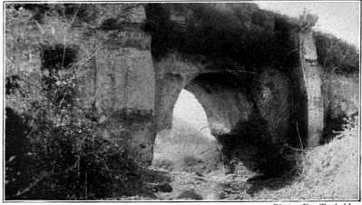 Historic aqueduct Aqua Marcia in Rome with detailed stone arches