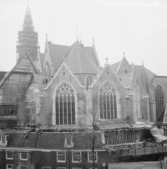 Old Church on the Old Church Square in Amsterdam with fully renovated facades seen from the Eastside Voorburgwal in black and white photograph