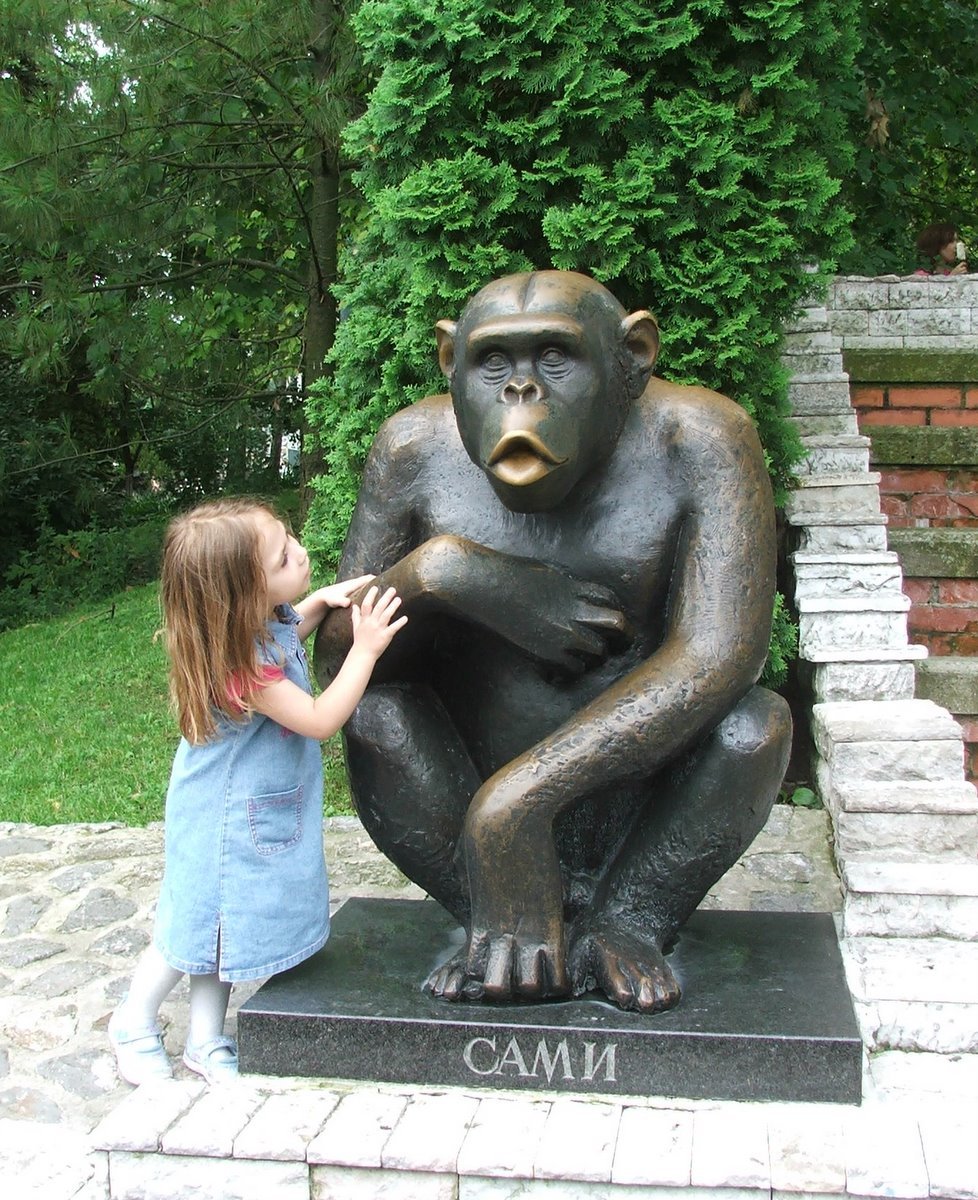 Sculpture of a monkey holding a person in Belgrade Zoo
