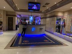 Grand Casino De Lyon entrance with illuminated sign Le Pharaon at night
