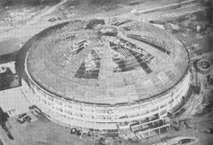 Aerial view of Araneta Coliseum under construction showing the framework and surrounding area