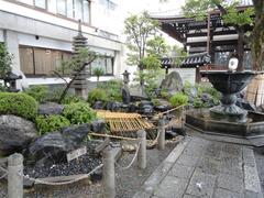 Honnō-ji temple in Kyoto, Japan with traditional architecture surrounded by trees