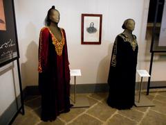 Two dresses displayed on mannequins in the exhibit Rossini Neapolitan fury 1868-2018 in Naples