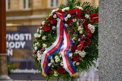 Thank You America Memorial in Pilsen Czech Republic with American flags and flowers