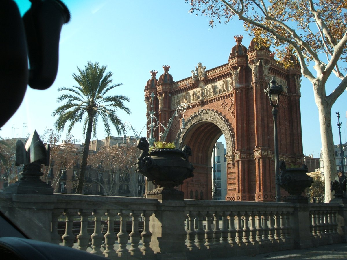 View of Barcelona cityscape with iconic buildings and sea in the background