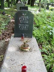 First family grave with multiple headstones surrounded by trees