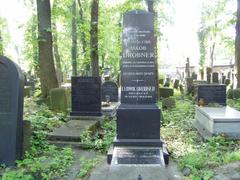 Grave of Jakub Drobner with tombstone and flowers in a cemetery