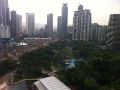 View of Kuala Lumpur city skyline with Petronas Twin Towers at sunset