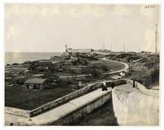 Aerial view of El Morro Castle overlooking Havana Bay with city buildings and water