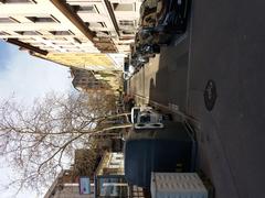 Street view in Lyon with parked cars and trees, seen from Cours Aristide Briand