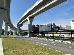 Kampung Batu Station bus and taxi stop with multiple vehicles and drop-off bays