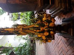 Traditional Thai flower offerings in a phan container at Siam Society Headquarters in Bangkok, Thailand