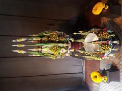 Traditional Thai flower offerings on phan containers at Siam Society headquarters in Bangkok, Thailand