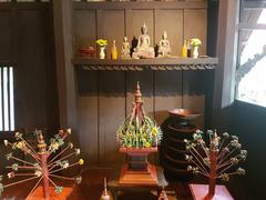 Buddhist images and offerings at Siam Society Headquarters in Bangkok, Thailand
