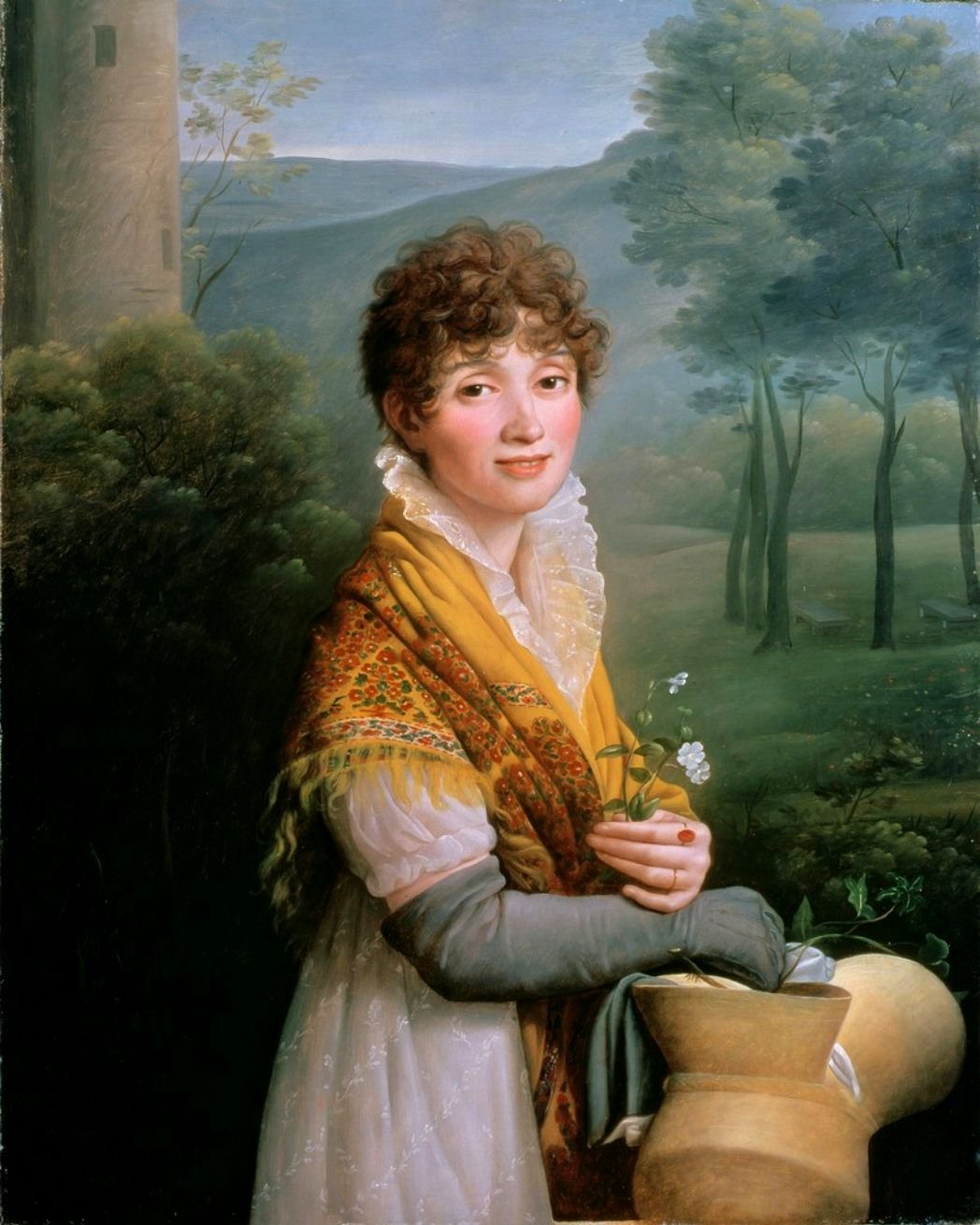 Portrait of a young woman with dark hair in classical attire