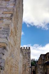 View of Castelo de São Jorge perched on a hill overlooking Lisbon city, Portugal