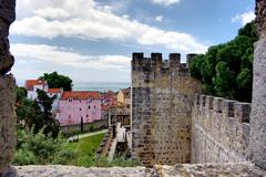 View of Castelo de São Jorge atop a hill with Lisbon cityscape below