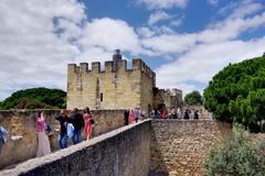 Castle of Saint George overlooking Lisbon cityscape with historic buildings and greenery