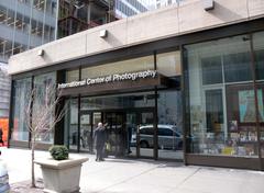 View looking west across 6th Avenue at the International Center of Photography on a sunny midday