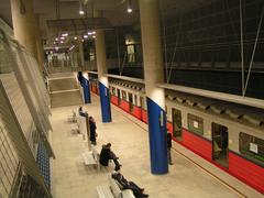 Marymont metro station platform with trains and passengers