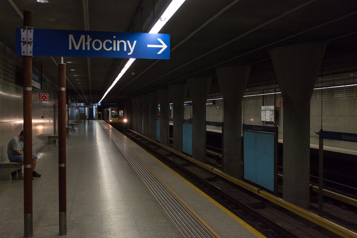 Wawrzyszew metro station platform in Warsaw, Poland with trains and passengers