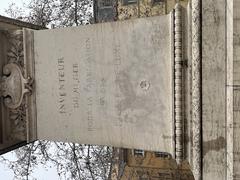 Statue of Joseph Marie Jacquard in Lyon with inscription on the west face