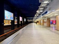 Warsaw Metro Centrum station platform with passengers and trains